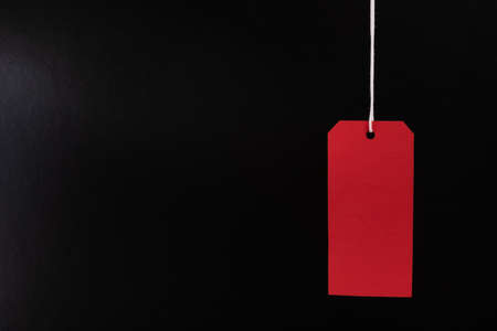 Black friday sale concept. Red Sale tag color on the black background with Copy space.Black Friday weekendの写真素材