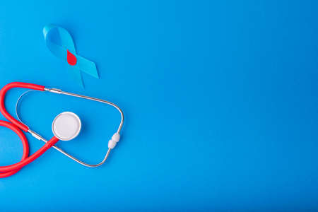 World diabetes day, Blue ribbon awareness with red blood drop on  blueの写真素材