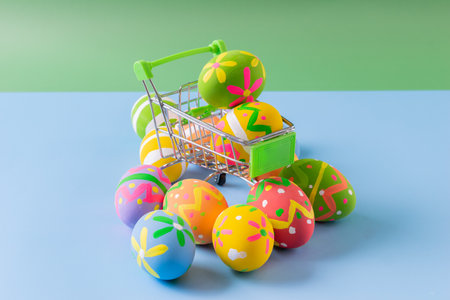 Easter eggs many color on trolley for easter backgroundの写真素材