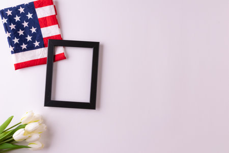 Happy presidents day concept with flag of the United States on white background with tulips for top view conceptの写真素材