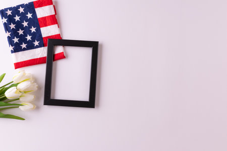 Happy presidents day concept with flag of the United States on white background with tulips for top view conceptの写真素材