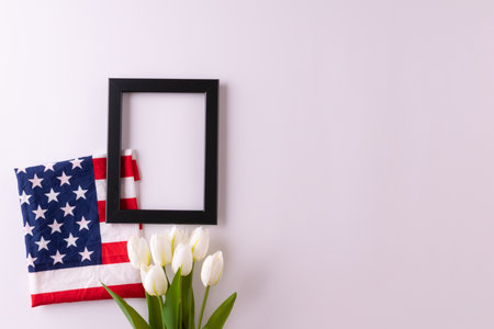 Happy presidents day concept with flag of the United States on white background with tulips for top view conceptの写真素材