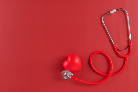 Red statoscope with red heart for Valentine day, World Health Day,World Blood Donor Day and Doctor day for concept top view background.の写真素材