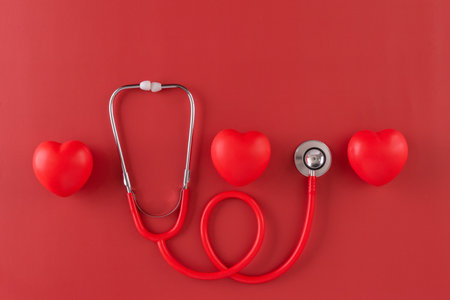 Red statoscope with red heart for Valentine day, World Health Day,World Blood Donor Day and Doctor day for concept top view background.の写真素材