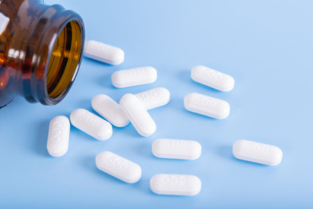 close up of medicine pills on blue backgroundの写真素材