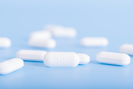 Medicine pills on blue backgroundの写真素材
