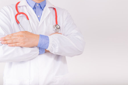 Doctor wear white lab coat with red stethoscop. Cardiology healthcare, healthy heart protection, cardiac diseases conceptの写真素材