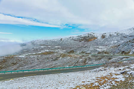 highway to mountain top with snowの写真素材