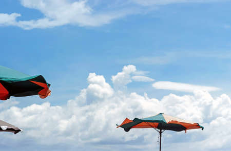 colorful parasols in blue skyの写真素材