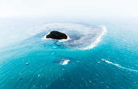 small island in blue ocean