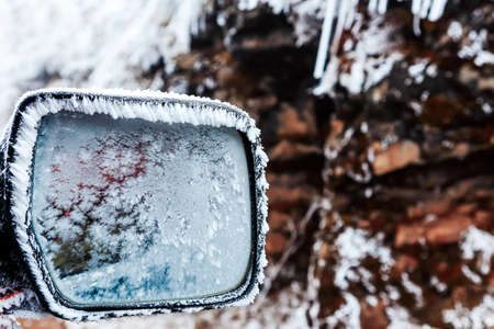 Frost on car mirror in winterの写真素材