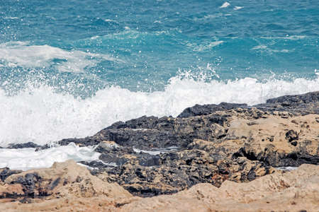 wave splash on rock at coastの写真素材