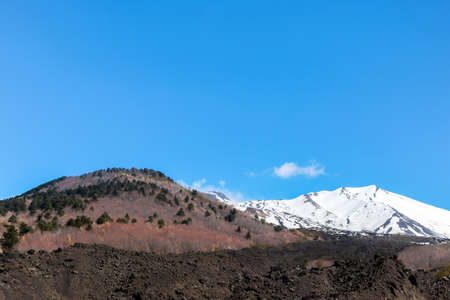 snow on mount etna with blue skyの写真素材