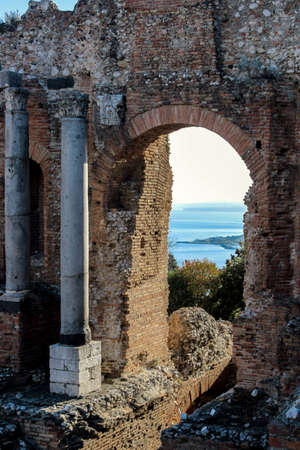 old ruins at greek theater in taormina sicilyのeditorial素材