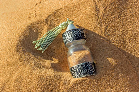 decoration glass bottle in sahara desert