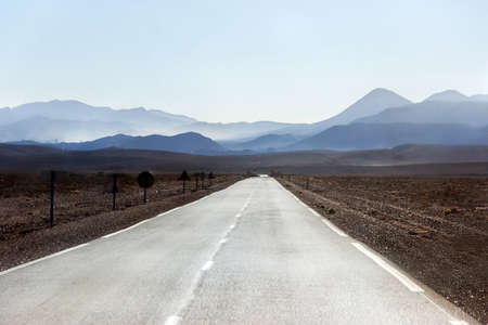 empty road in desert with atlas mountainの写真素材