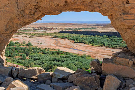 hole on stone wall at ait ben haddouの写真素材