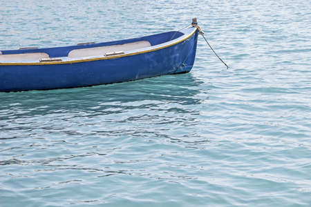 small boat floating in oceanの写真素材