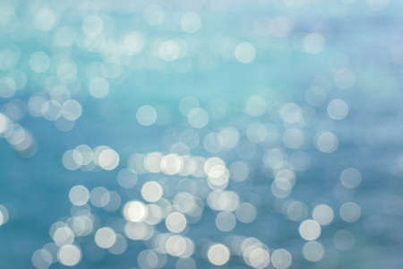 blurry light spots on oceanの写真素材