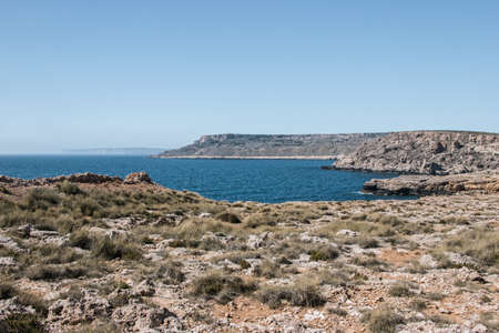 peaceful ocean with cliff in maltaの写真素材