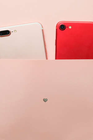 Two smartphones and heart. Valentines conceptの写真素材
