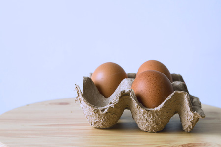 Eggs on the table on white background