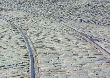 Streetcar tracks on cobblestone street in Baltimoreの写真素材