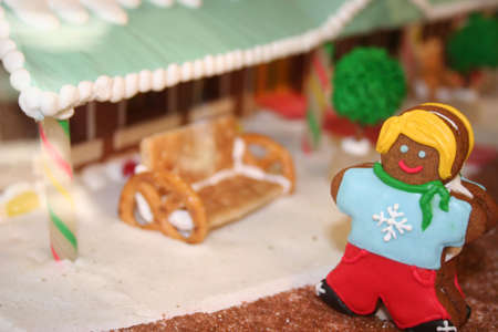 Holiday gingerbread girl on decorated street sceneの写真素材