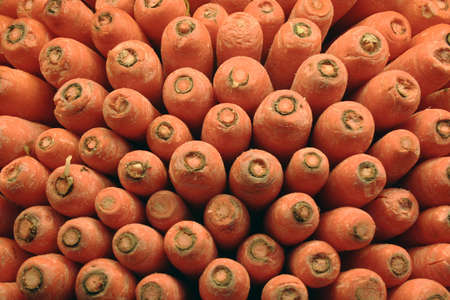 Carrots at market stacked up for displayの写真素材