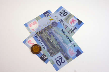 Mexican pesos on white backgroundの写真素材
