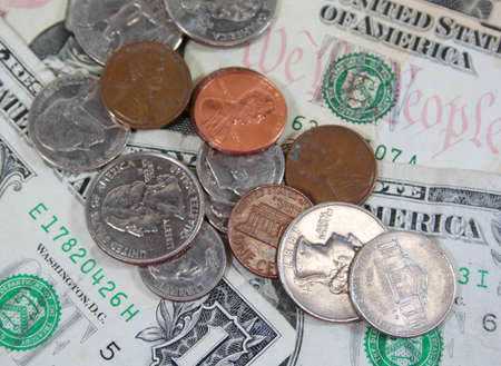 US currency dollars and coins closeup detailの写真素材