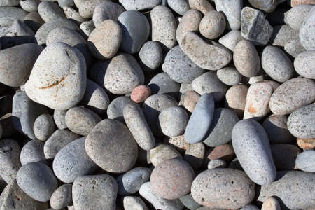 Seaside background of smooth rocks