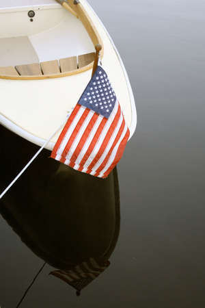 Bow of boat in harbor with US flagの写真素材