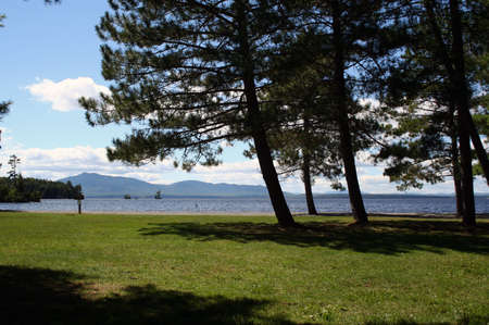 Summertime in park near large lake in Maineの写真素材