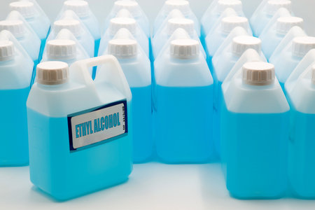 Multiple containers of ethyl alcohol, featuring a vibrant blue liquid.の写真素材