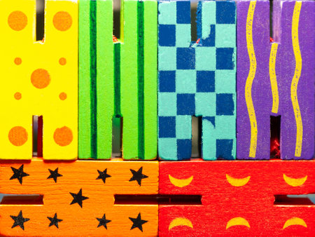 Brightly colored wooden toy pieces display various textures and patterns.の写真素材