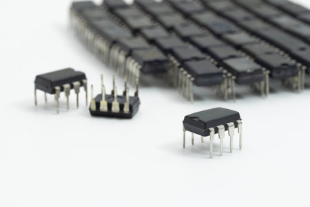 Close-up of integrated circuit IC chips on white background, symbolizing microelectronics,...