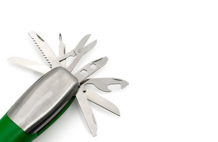 Close-up of a stainless steel all-in-one pocket multitool with blades and accessories extended,...