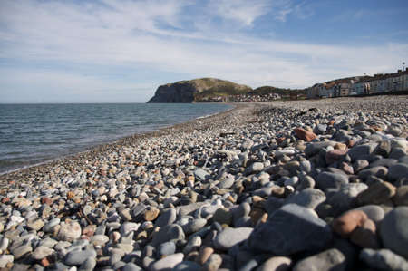 Llandudno pebbled beach. With The Little Orme. の写真素材