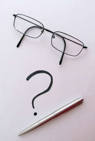 Glasses with pen and question mark on white blank paper Wtriter's Black                     の写真素材
