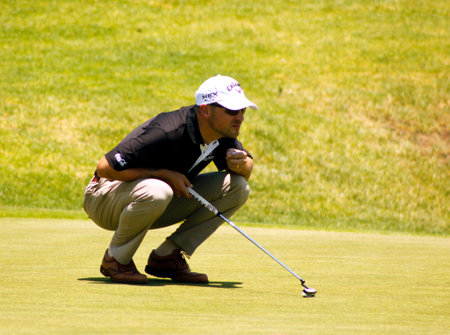 FASTH, NICLAS - NOVEMBER 17: Professional Golfer Playing at Gary Player Charity Invitational Golf Tournament  November  17, 2013, Sun City, South Africa. Niclas finding the best putting line.のeditorial素材