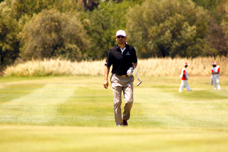 FASTH, NICLAS - NOVEMBER 17: Professional Golfer Playing at Gary Player Charity Invitational Golf Tournament  November  17, 2013, Sun City, South Africa. Niclas walking up fairway.のeditorial素材