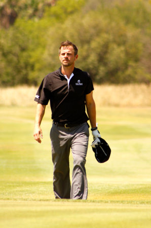 GIOVINAZZO , CARMINE  - NOVEMBER 17: Actor Guest Player Playing at Gary Player Charity Invitational Golf Tournament  November  17, 2013, Sun City, South Africa. Carmine walking down fairway.のeditorial素材