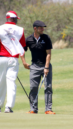 GIOVINAZZO , CARMINE  - NOVEMBER 17: Actor Guest Player Playing at Gary Player Charity Invitational Golf Tournament  November  17, 2013, Sun City, South Africa. Carmine final put.のeditorial素材