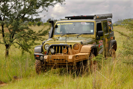 BAFOKENG - MARCH 8: Gecko Pearl Green Jeep Wrangler Rubicon crossing obstacle at Leroleng 4x4 track...