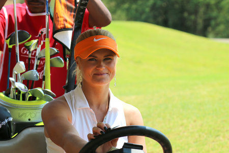 BOOTH, CARLY - NOVEMBER 15: Pro Golfer Playing at Gary Player Charity Invitational Golf Tournament behind steering wheel of golf cart on November 15, 2015, Sun City, South Africa.のeditorial素材
