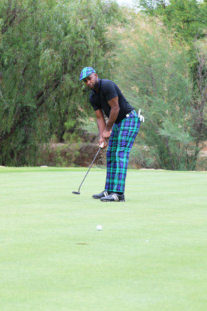 JOSEPH, JOHNATHAN - NOVEMBER 15: Radio Celebrity Playing at Gary Player Charity Invitational Golf Tournament following his put shot on November 15, 2015, Sun City, South Africa.のeditorial素材