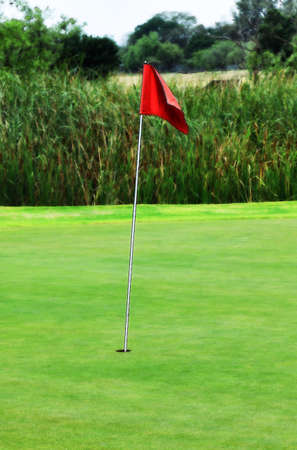HD Enhanced Photo Illustration of Golf Green Red Putting Hole Flagの写真素材