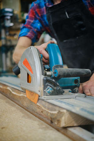 Work table of a carpenter with a gouge and a pile of wood chips. Close up Vercion 7の写真素材