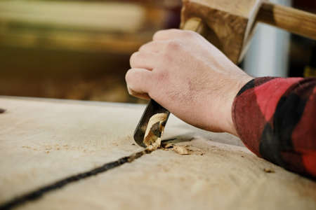 Close up Traditional craftsman carving wood. Vercion 3の写真素材